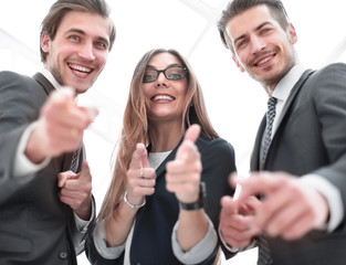 Close up of young people pointing at you