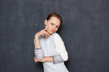 Portrait of comic flirty woman imitating sexy photo pose