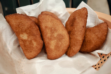 Venezuelan empanadas made of corn meal and stuffed with shredded beef and cheese, deep fried