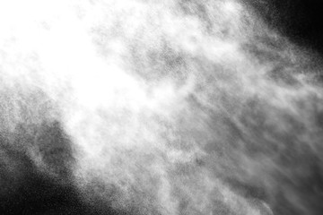 A stream of water and a cloud of drops