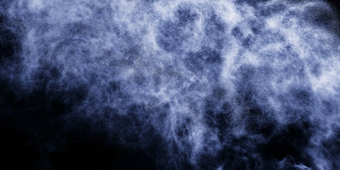 A stream of water and a cloud of drops