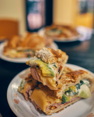 sandwich with baguette bread on a glass table on a white plate