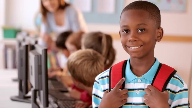 Boy wearing backpack at school