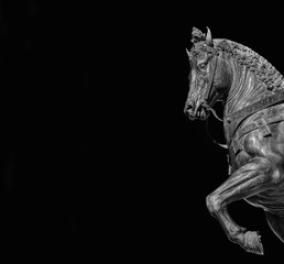 Fototapeta na wymiar War horse from Bartolomeo Colleoni equestrian monument in Venice, cast by renaissance artist Verrocchio in the 15th century (Black and White with copy space)