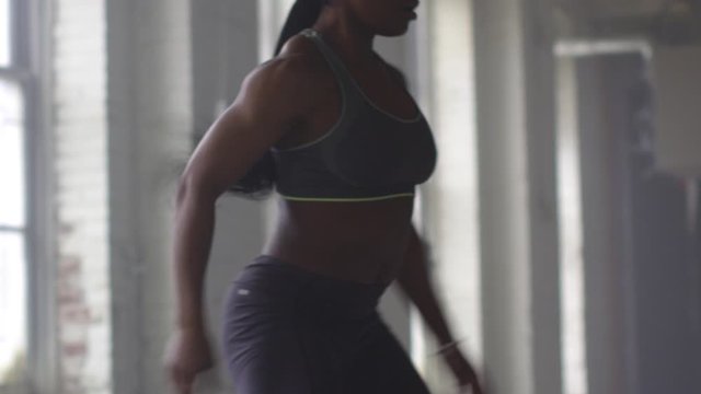 Black athlete working out in gymnasium