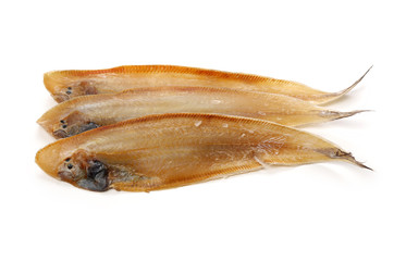 Dried salted fishes on white background