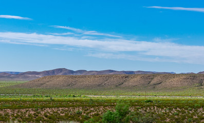 Fototapeta na wymiar landscape with green field and blue sky