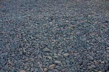 background from a pile of small stones of gray rubble