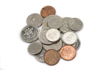 An assorted pile of modern Canadian coins isolated, up close in macro, on a clean white background