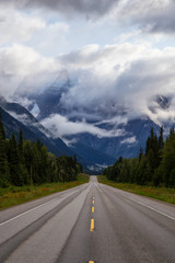 Fototapeta premium Beautiful View of Yellowhead Highway with Mount Robson in the background during a cloudy summer morning. Taken in British Columbia, Canada.