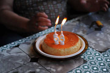 Fototapeta na wymiar Birthday celebration, 53 years old. 53 year old candle pudding lighted. Congratulations. Close view. No one.