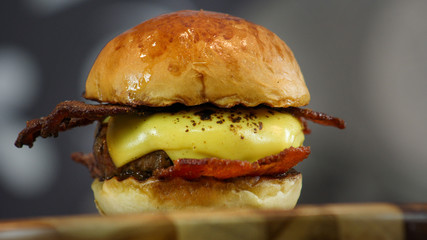 Cheeseburger with bacon and melted cheese in brioche buns