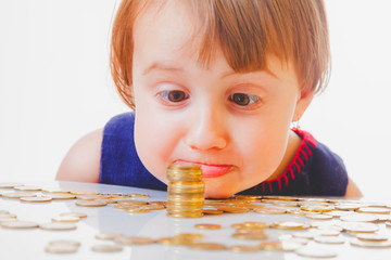 Best motivation is money. Little child girl with coints.