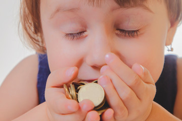 Best motivation is money. Happy business child girl sniffing money