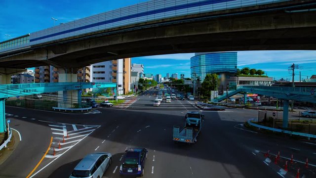 A timelapse of downtown street at Kanpachi avenue in Tokyo daytime wide shot zoom