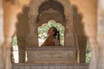Women traveling in India, Majestic Gaitor Ki Chhatriyan temple, stone carved monuments