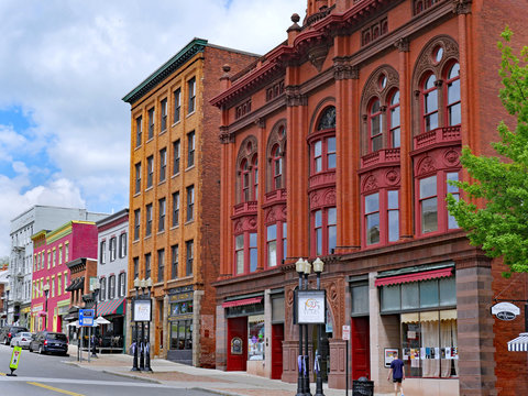 GENEVA, NY, USA - MAY 2019:  This Town In The Finger Lakes Has Numerous Well Preserved19th Century Buildings, Including These Colorful Main Street Storefronts.