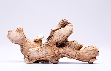 Closeup of dry ginger on white background