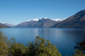 Naklejka na ściany i meble Stunning glacial lake coastal scenery in New Zealand Southern Alps