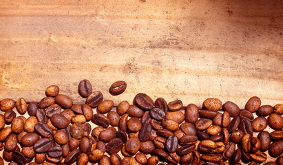 Coffee beans on wooden background