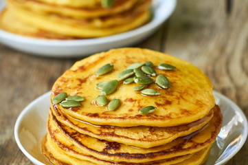 Pumpkin pancakes with seeds and honey