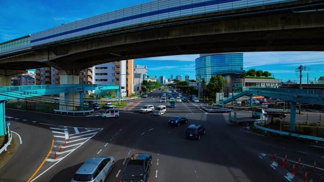 A timelapse of downtown street at Kanpachi avenue in Tokyo daytime wide shot zoom