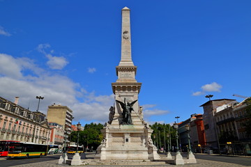 Fototapeta na wymiar Monument to the Restorers (Monumento dos Restauradores) at Restauradores Square in Lisbon, Portugal