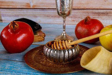 On the synagogue are the symbols of Rosh Hashanah apple and pomegranate, shofar