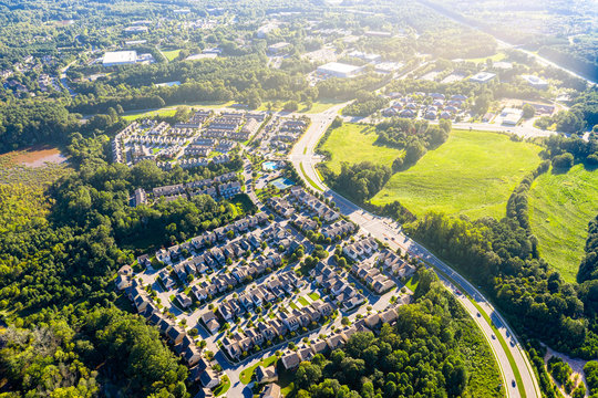 Aerial picture suburban gated community southern united states during sunset and sunrays