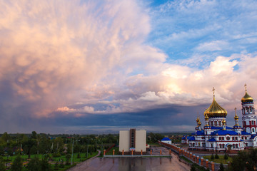 Russian Orthodox Cathedral of the Nativity in Novokuznetsk against a beautiful sky with beautiful clouds and clouds.