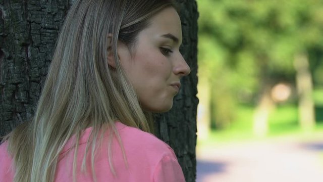 Jealous woman spying her boyfriend meeting with friend, treason, close-up