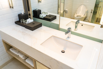 Fototapeta na wymiar Faucet water and sink decoration in bathroom interior