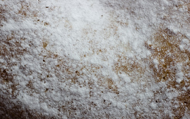 The texture of baking with icing sugar. Cake with white powder macro shot.