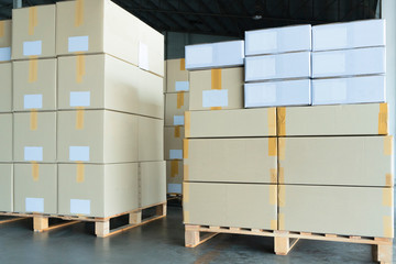 Packaging Boxes Stacked on Pallets in Storage Warehouse. Cartons Cardboard Boxes. Supply Chain. Storehouse Distribution. Shipping Warehouse Logistics.	
