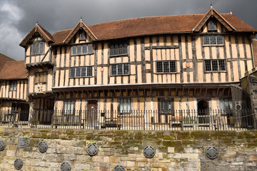 Fototapeta na wymiar Tudor style Medieval courtyard architecture of Lord Leycester Hospital guildhall for retired ex-servicemen on High Street Warwick England