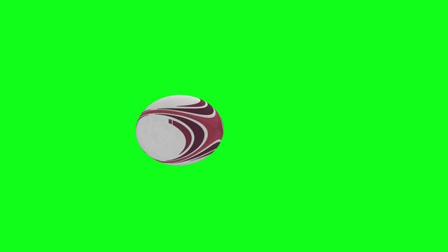 Rugby ball animation.  Red rugby ball animation, spinning slowly from left to right at a slight angle, with a green screen background.