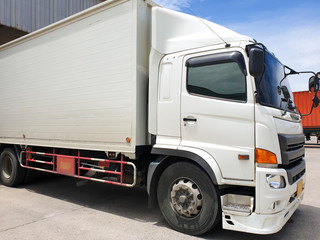 white truck docking load cargo at warehouse. freight industry logistics.