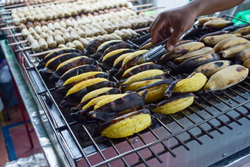 Grilled Banana, cultivated banana fruit on a hot charcoal grill
