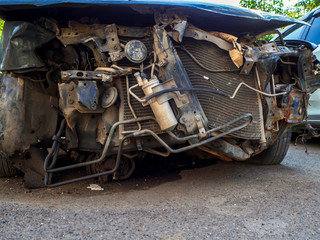 mangled broken in accident the car is abandoned in the Parking lot