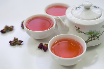 Rose tea on a white background
