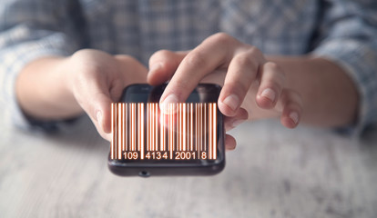 Business girl showing bar code. Warehouse, logistic and financial concept