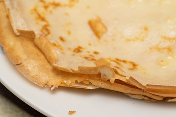 Food. Fried pancake with butter, pancake with yellow butter, background, slice