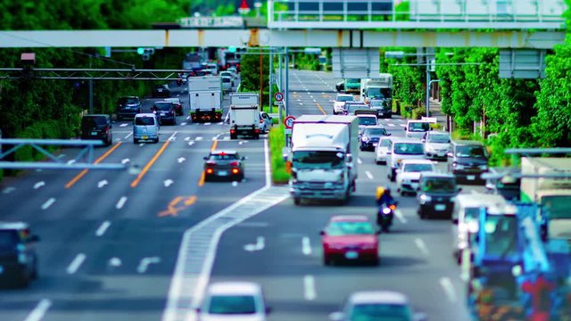 A timelapse of downtown street at Kanpachi avenue in Tokyo daytime tilt-shift panning