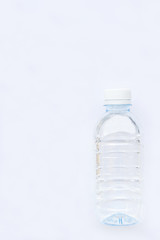 close up of bottle of water isolated on white background