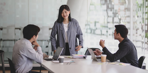 Young professional startup team discussing the concepts of the new project together