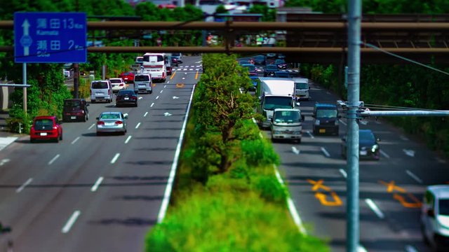 A timelapse of downtown street at Kanpachi avenue in Tokyo daytime tilt-shift tilting