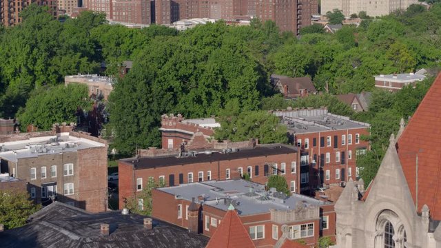 Aerial push and rise over historic homes in St. Louis