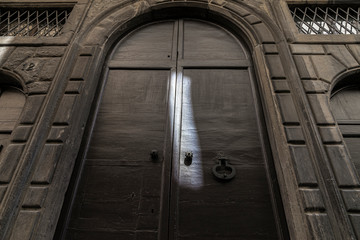 Аn old wooden door to a church