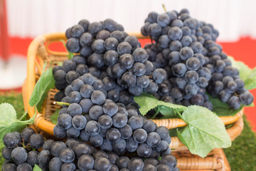 Basket full of fresh red grapes.