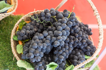 Basket full of fresh red grapes.